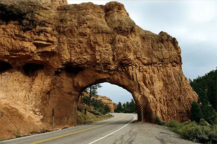 System measuring vehicle height in real time to prevent bridge collisions, warn drivers exceeding clearance limits, and support height-based tolling.