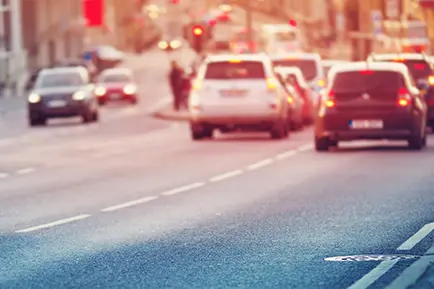 System detecting unsafe distances between trucks, monitoring speed and classification, and generating infraction reports using a single ANPR camera.